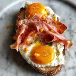 Indulge in Fried Egg Yolk, Burrata and Prosciutto Toast