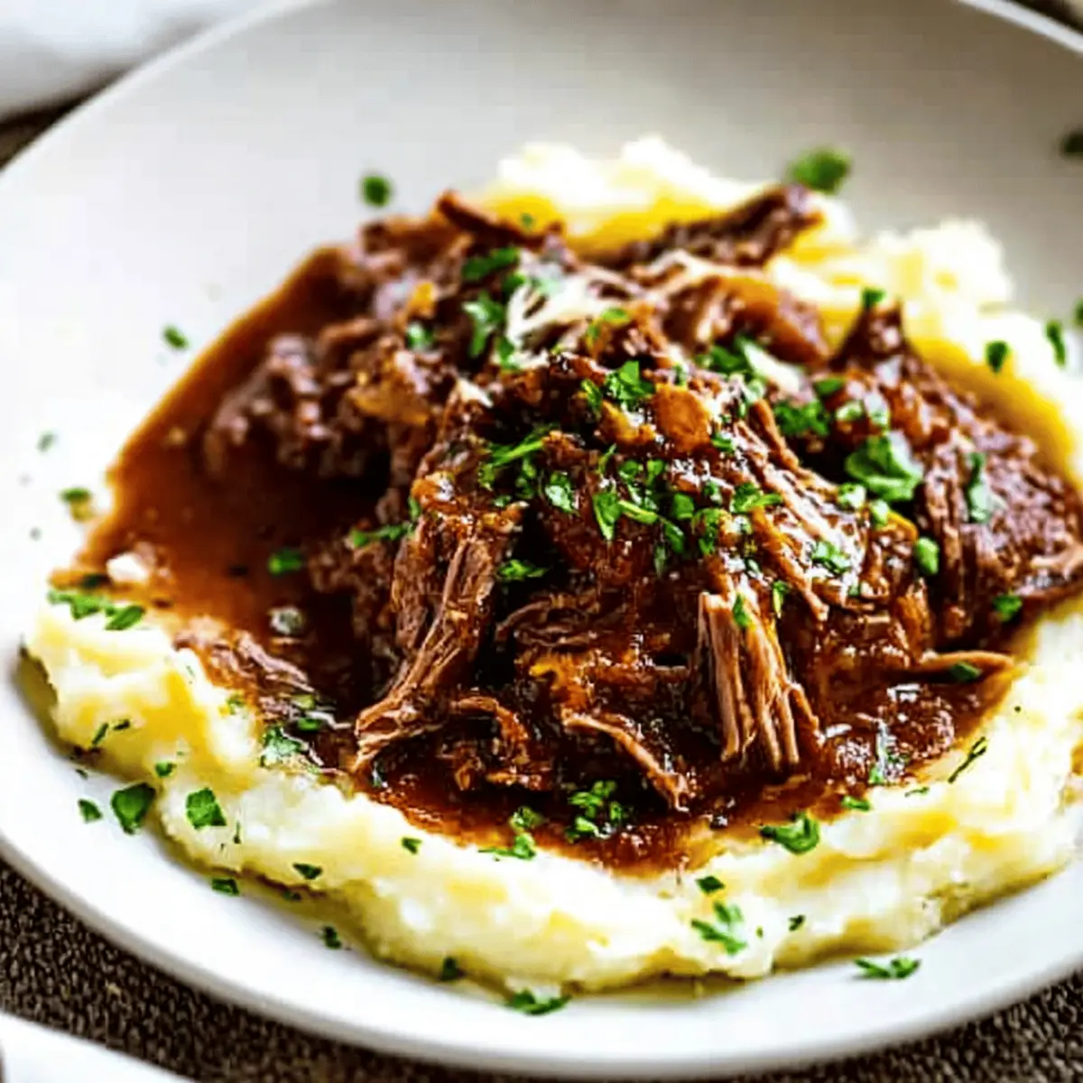 Tender Short Rib Ragu Over Silky Parmesan Mashed Potatoes Recipe